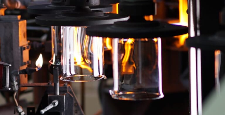 Beaker spouts being formed under burner flame at the Koga Plant